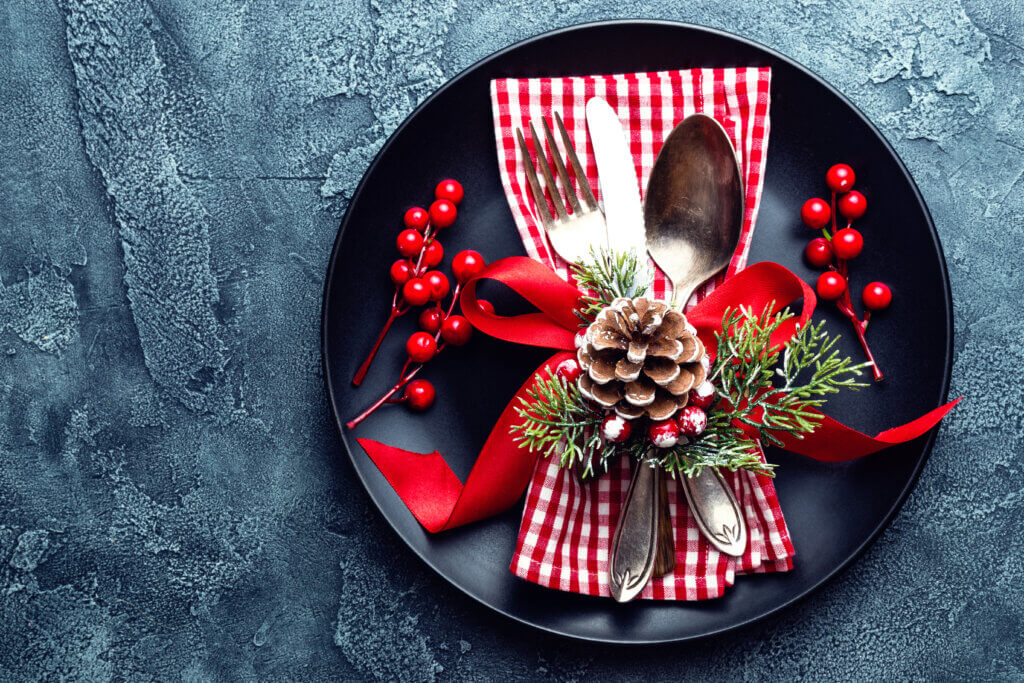 Christmas decoration. Festive plate and cutlery with Christmas decoration. Christmas background
